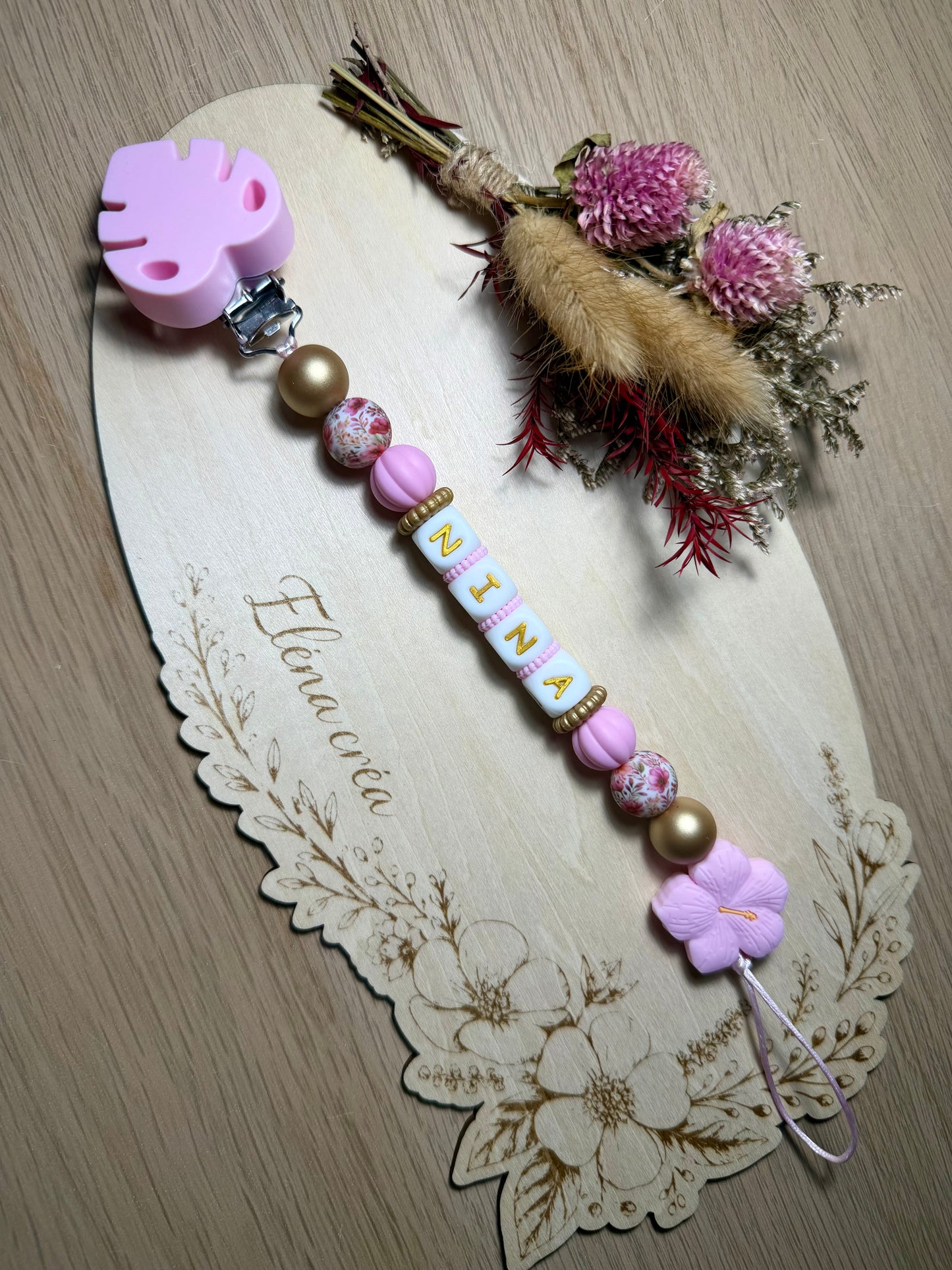 Attache tétine fleur